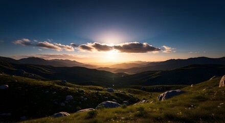 Golden sunbeams over verdant rolling hills and mountains