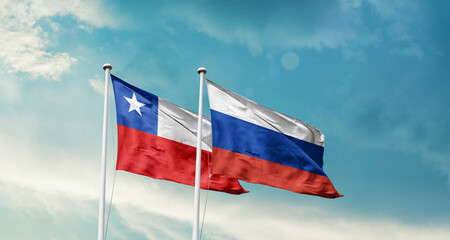 Chile and Russia friendship flags are waving in the sky. Double country Flag waving with mast. Chile Russia national flag for agreement.