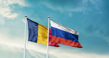 Chad and Russia friendship flags are waving in the sky. Double country Flag waving with mast. Chad Russia national flag for agreement.
