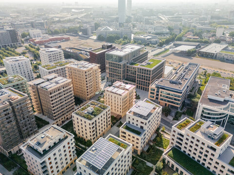 Aerial view of the The Paris 2024 Olympic and Paralympic Village with green roofs contrasting against the urban landscape, Saint-Ouen-sur-Seine, &Atilde;Žle-de-France, France.