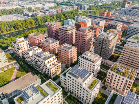 Aerial view of the The Paris 2024 Olympic and Paralympic Village, with modern buildings displaying various colors, textures and rooftop gardens, Saint-Ouen-sur-Seine, &Atilde;Žle-de-France, France.