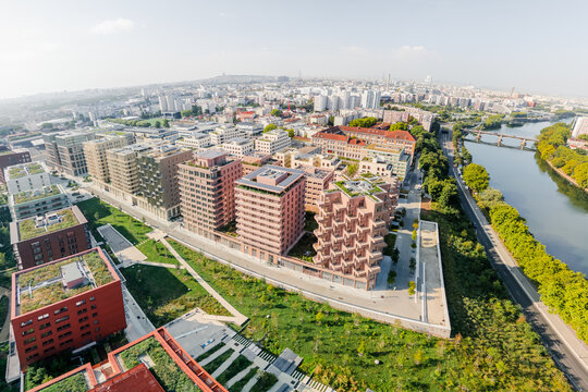 Aerial view of the The Paris 2024 Olympic and Paralympic Village with striking architectural design nestled beside the winding Seine River, Village des Athl&Atilde;&uml;tes Olympiques, &Atilde;Žle-de-France, France.