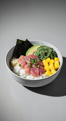 Tuna Poke Bowl with Mango and Edamame on Pink Background