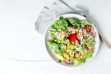 Rice salad with corn and tomato