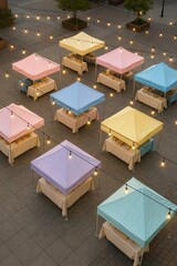 Pastel tents arranged in a festive plaza with string lights glowing in the evening, perfect for market or fair scenes.

