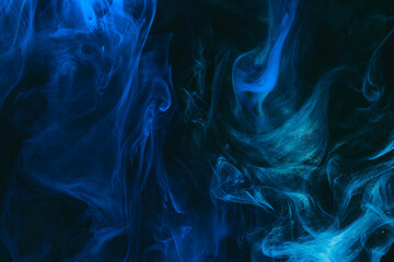 Abstract colorful smoke background. Moving flow of dark blue paints, fluid art