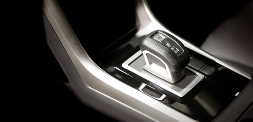 EV Car gear. Close up of modern automatic car gear shifters in luxury vehicle interiors. Feature sleek ergonomic designs and advanced car transmission controls for premium driving experience. EV gear