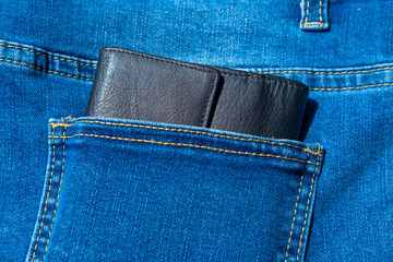 Euro banknotes in denim jeans pocket, European economy, smart personal financial management,...