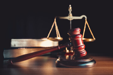 Judge’s gavel on wooden table, symbolizing judgment, law, fairness, and legal authority in court...