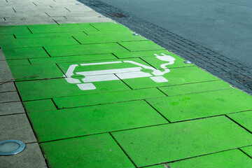 EV charging station parking, green public space, electric vehicle infrastructure, green transport, eco-friendly, parking lot, electric mobility, zero emission, alternative energy,