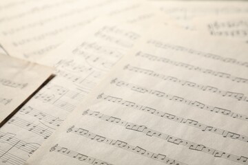 Fototapeta premium Sheets with musical notes as background, closeup