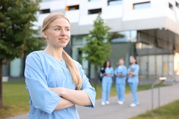 Fototapeta premium Medical student in uniform outdoors, selective focus