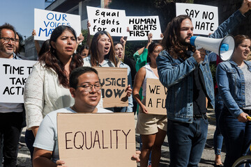 Group of Latin people activists protesting on streets for Human Rights in Mexico Latin America, Hispanic women and men together in a meeting for peace and equality
