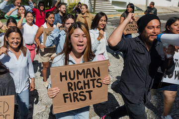 Group of Latin people activists protesting on streets for Human Rights in Mexico Latin America, Hispanic women and men together in a meeting for peace and equality