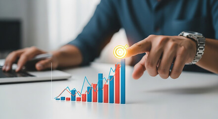 Business growth, man pointing at rising bar chart with glowing target icon, concept of financial success, market performance and data analytics strategy
