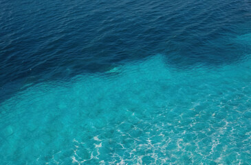 Obraz premium Vibrant blue water surface. Top view, clear refreshing.