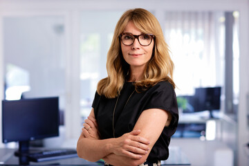 Executive businesswoman standing at the office