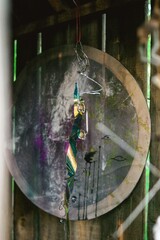 Abstract Metal Art Hanging on Wooden Wall. A Whimsical and Unique Decor Piece for Creative Spaces