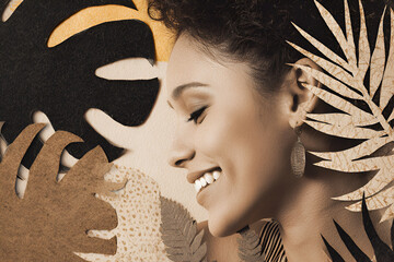 Young Brazilian woman smiling with closed eyes in  collage of tropical paper leaves, side profile against artistic textured background, ideal for beauty, fashion. natural, jungle, harmony, art, female