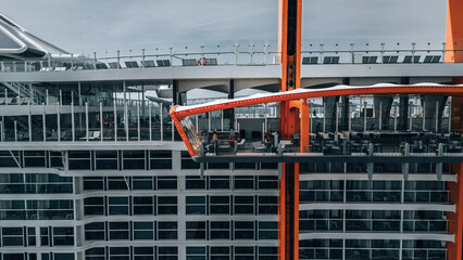 Aerial view of a modern architectural marvel with stark white lines contrasting against bold orange accents, Split, Split-Dalmatia County, Croatia.