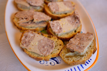A plate of toasted baguette with Foie Gras slices