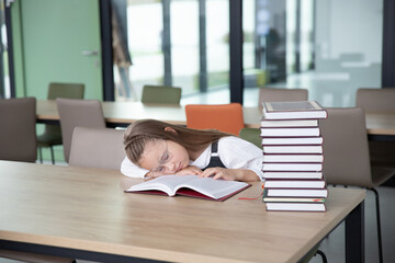 Young Girl Asleep in Library with Books