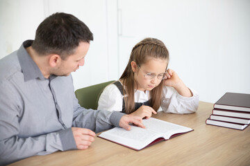 Fototapeta premium Father Assisting Daughter with Homework