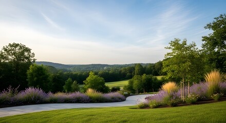 Obraz premium Winding Driveway Lined With Purple Flowers And Green Grass