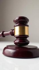 Close-up of judge's gavel, pure white backdrop, jurisprudence, fairness, closeup