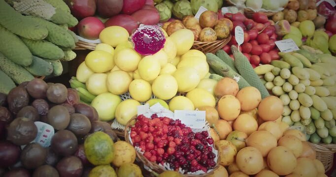 Variety of exotic tropical fruits on wicker baskets at Lavradores Market in Madeira Island, Portugal