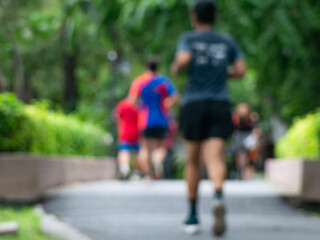 Blurred Runner, Jogger in Public Park, Active Lifestyle Background