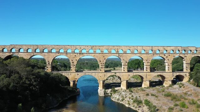 The Pont du Gard is an ancient Roman aqueduct, that is depicted  on five euro note. Summertime.