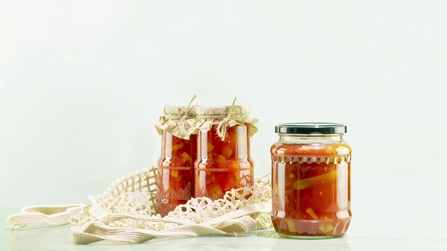 Hand Taking Jar Of Fermented Vegetables From Crochet Bag And Placing It On Table For Organic Food Visuals, Homemade Preservation Concepts, Healthy Eating Trends, And Eco Lifestyle Branding