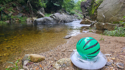 Watermelon Inflatable Ball on a Riverside in Summer