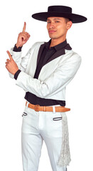 Young cheerful chilean Huaso wearing traditional white suit with black details pointing upwards with index finger, Fiestas Patrias celebration	