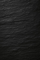 Textured black slate background with layered pattern and depth