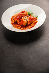Stuffed cabbage tomato sauce with beans meat, cabbage, fresh delicious gourmet food background on the table rustic food top view copy space