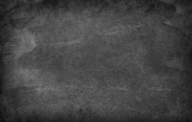 Black paper surface with grainy texture