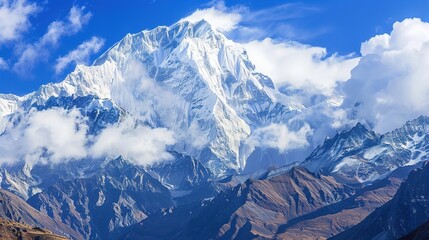 Obraz premium Cloudy, landscape, range, snow, scenery, mountain, blue sky and white clouds: Peaks Kissing Blue Skies & White Clouds, Where Snow-Clad Summits Paint Breathtaking Scenery Across Vast Mountain Ranges.
