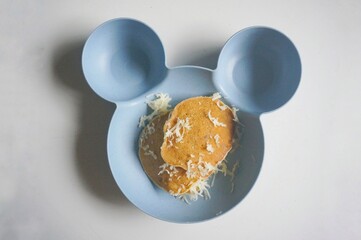 Banana pan cake with cheese sprinkled on top