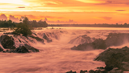 Spectacular view of the waterfall during sunset. The impressive wide waterfall.