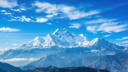 Obraz premium Cloudy, landscape, range, snow, scenery, mountain, blue sky and white clouds: Peaks Kissing Blue Skies & White Clouds, Where Snow-Clad Summits Paint Breathtaking Scenery Across Vast Mountain Ranges.