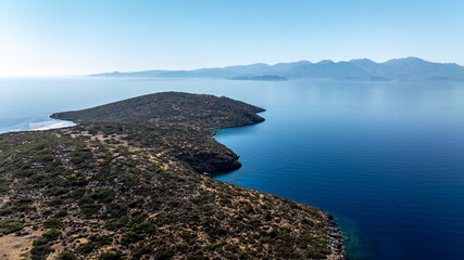 panoramic drone view of coastal sea water and rocky shore near Crete island