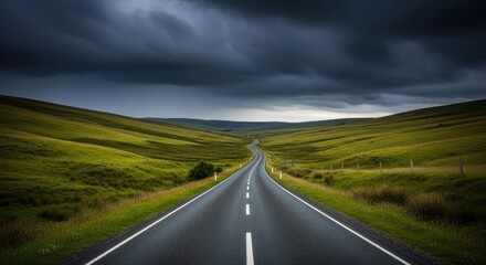 Fototapeta premium Embark on an epic journey down a winding asphalt road through dramatic green rolling hills under a stormy sky
