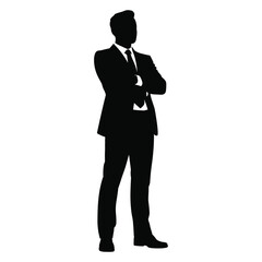 Silhouette of a confident businessman standing with arms crossed