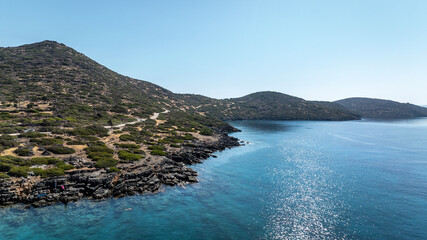 panoramic drone view of coastal sea water and rocky shore near Crete island