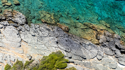 panoramic drone view of coastal sea water and rocky shore near Crete island