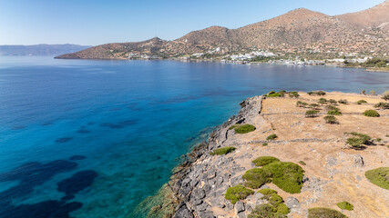 panoramic drone view of coastal sea water and rocky shore near Crete island