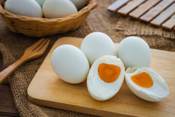 Salted duck eggs on wooden board