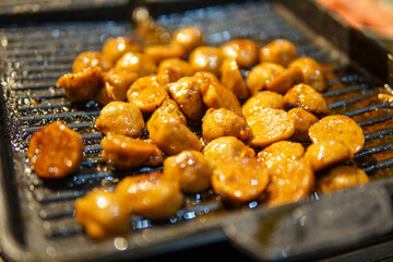 Grilled Meatballs on a Hot Iron Grill with Seasoned Glaze
